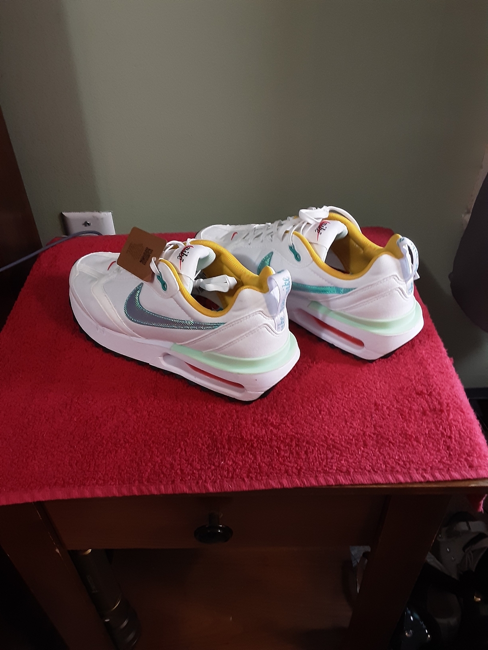 Nike White Sneakers with Teal and Yellow Accents